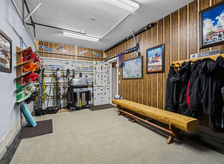 This spacious garage is a ski enthusiast's dream, featuring ample storage for skis, snowboards, and winter gear.