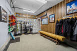 This spacious garage is a ski enthusiast's dream, featuring ample storage for skis, snowboards, and winter gear.
