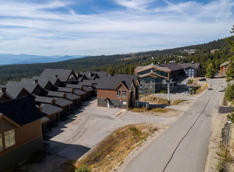 Discover this stunning mountain property featuring a collection of modern townhomes with classic ski lodge architecture.