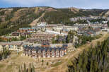 Discover this stunning mountain resort property, featuring a collection of architecturally rich buildings nestled amidst a scenic landscape.