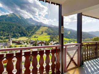 Experience breathtaking mountain views from this charming balcony, perfect for enjoying your morning coffee or evening wine.