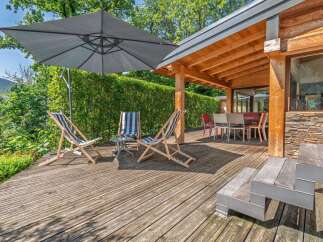 Enjoy the outdoors on this spacious wooden deck, perfect for relaxation and entertaining.