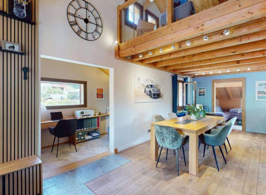 Discover this charming home featuring a dedicated home office space with a desk and printer, perfect for remote work.