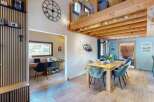 Discover this charming home featuring a dedicated home office space with a desk and printer, perfect for remote work.