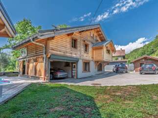 Experience luxury mountain living in this stunning log home, featuring a private swimming pool and a spacious wooden deck perfect for relaxation.