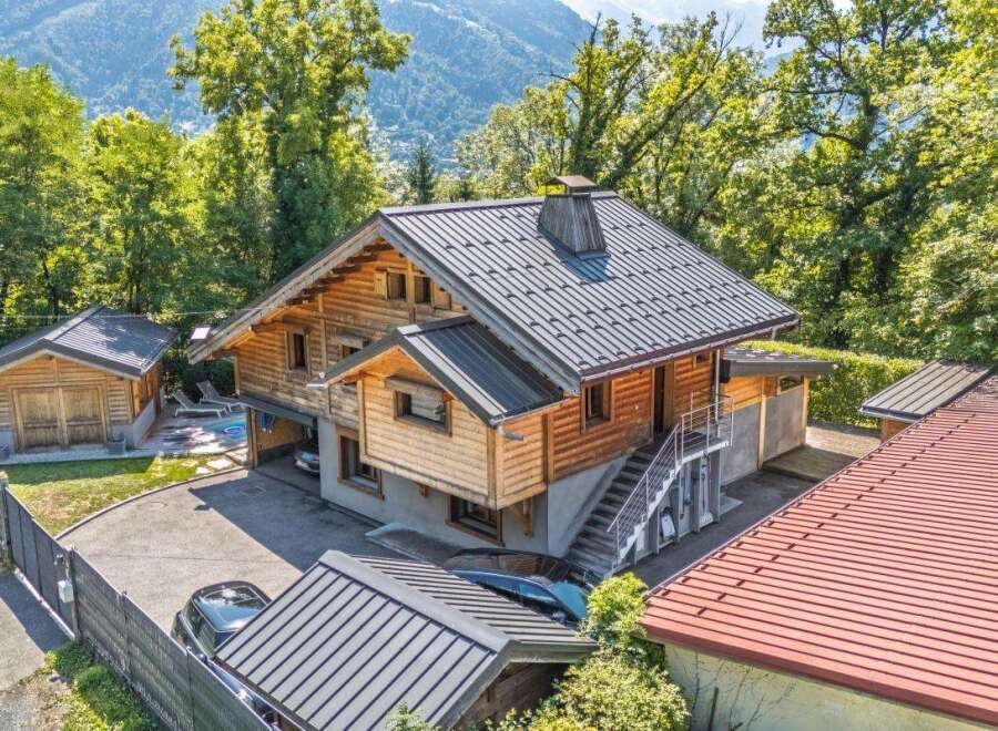Experience the charm of this rustic wooden chalet nestled amidst lush greenery and mountain views.