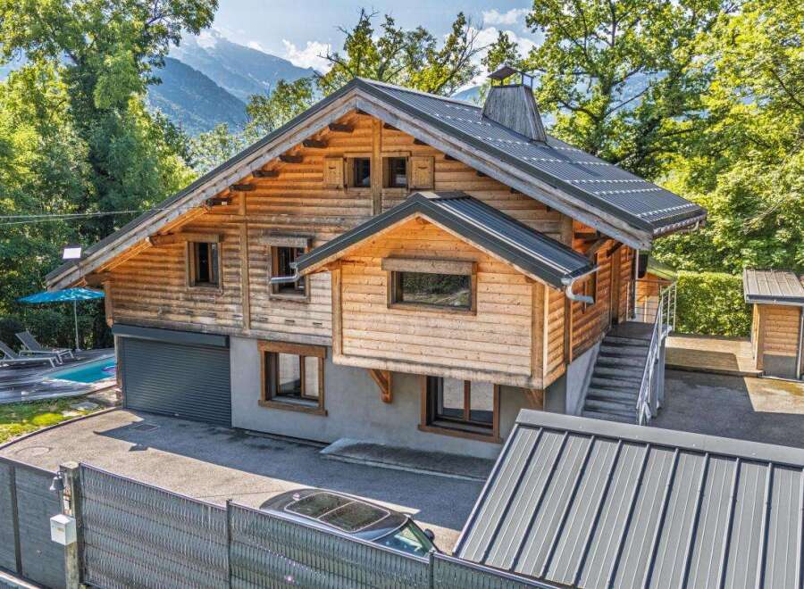 Experience the charm of this stunning wooden chalet, nestled amidst lush greenery with majestic mountain views.