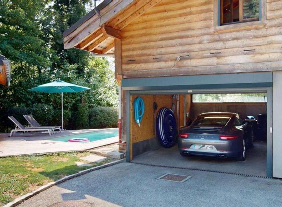 Experience luxury living with this stunning property featuring a private swimming pool and a spacious garage.