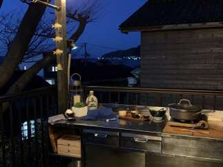 Experience serene evenings on this charming balcony, perfect for outdoor cooking and dining.