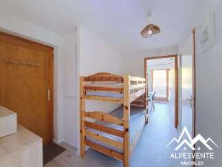 This charming property features a cozy bunk bed setup, perfect for accommodating guests or family.