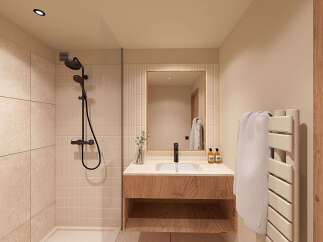 Experience modern luxury in this stunning bathroom featuring a sleek walk-in shower with elegant tiling and a contemporary black showerhead.