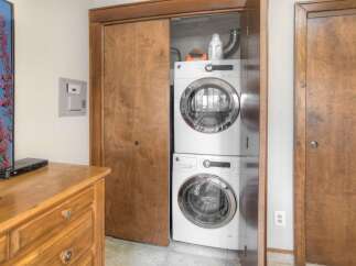 Discover convenient in-unit laundry with this stacked GE washer and dryer set, perfect for maximizing space.