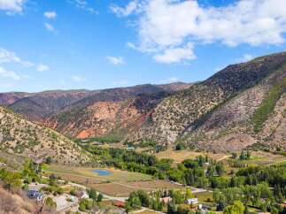 Nestled within a picturesque mountain valley, this property offers a serene escape with stunning natural beauty.