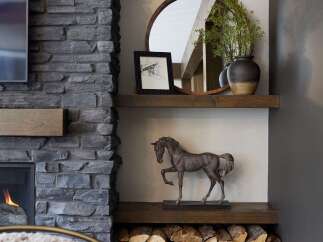 Cozy up by the stone fireplace, a perfect focal point for this inviting living space.