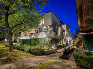 Experience modern living in this stunning multi-level residence, beautifully illuminated at dusk.