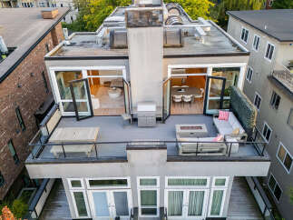 Experience luxurious urban living with this stunning rooftop patio, perfect for entertaining.