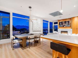 Experience luxury living with breathtaking city and mountain views from this stunning modern residence.