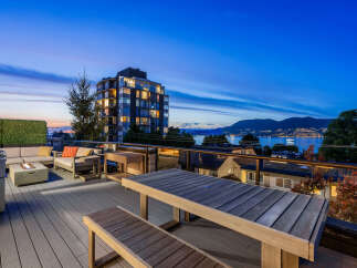 Experience breathtaking sunset views from this stunning rooftop deck, perfect for entertaining or relaxing.