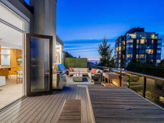 Experience luxurious outdoor living on this expansive deck, perfect for entertaining.