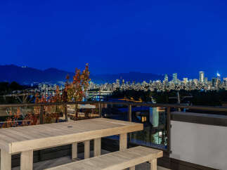 Experience breathtaking city and mountain views from this stunning balcony, perfect for evening entertaining.