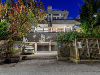 Discover modern living in this stunning multi-level residence, featuring a sleek grey exterior and expansive windows that invite natural light.