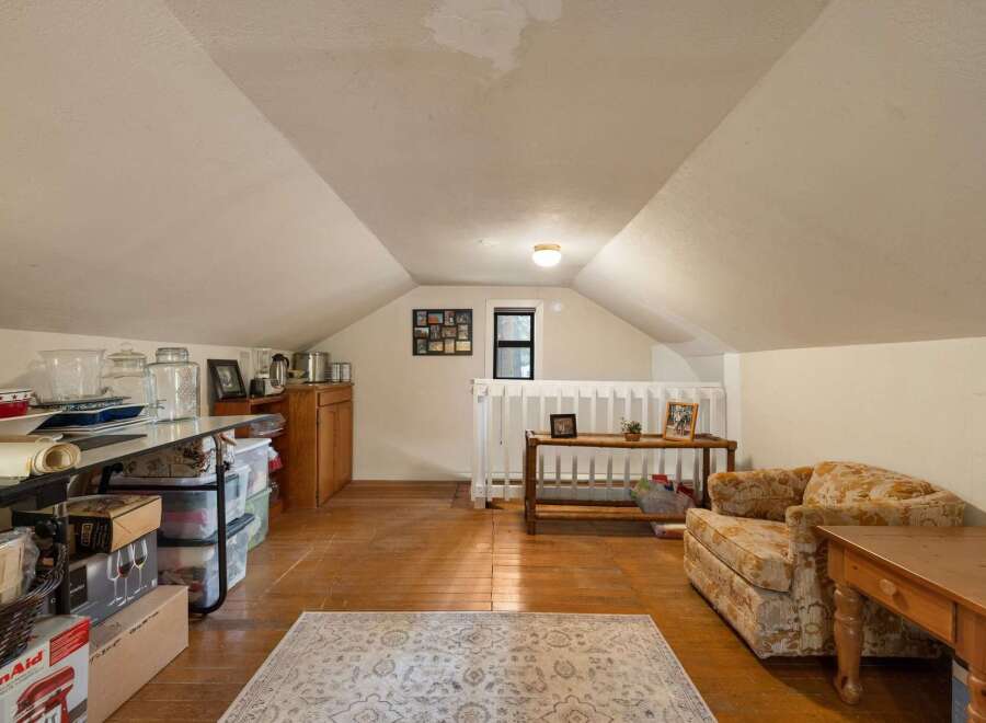Discover versatile living space in this charming attic room, perfect for a home office, playroom, or extra storage.