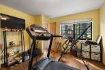 Transform your home into a personal fitness sanctuary with this dedicated workout space.