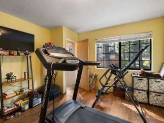 Transform your home into a personal fitness sanctuary with this dedicated workout space.