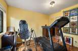 This home gym features a ProForm treadmill and an inversion table, perfect for your fitness routine.