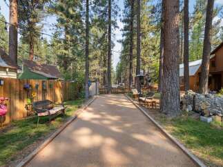 Enjoy outdoor fun on this property featuring a dedicated bocce ball court, perfect for friendly competition.