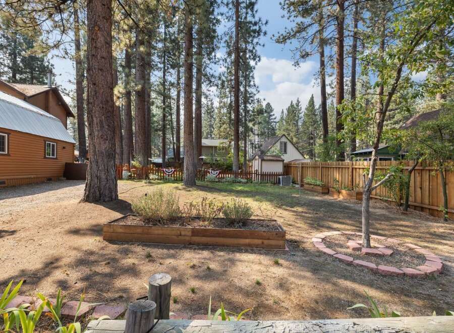 Discover this charming backyard oasis, perfect for outdoor living and entertaining.