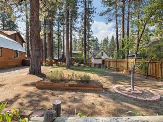 Discover this charming backyard oasis, perfect for outdoor living and entertaining.