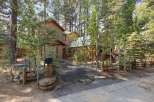 Nestled amongst tall pine and aspen trees, this charming property offers a serene mountain retreat.