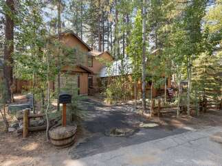 Nestled amongst tall pine and aspen trees, this charming property offers a serene mountain retreat.