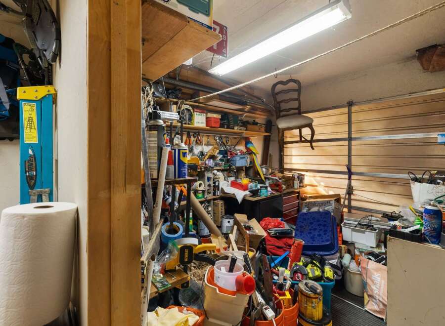 This garage space offers ample storage solutions for all your tools and equipment.