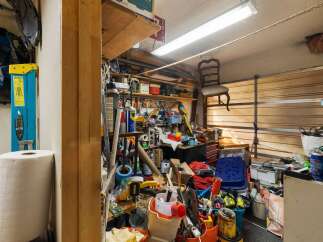 This garage space offers ample storage solutions for all your tools and equipment.