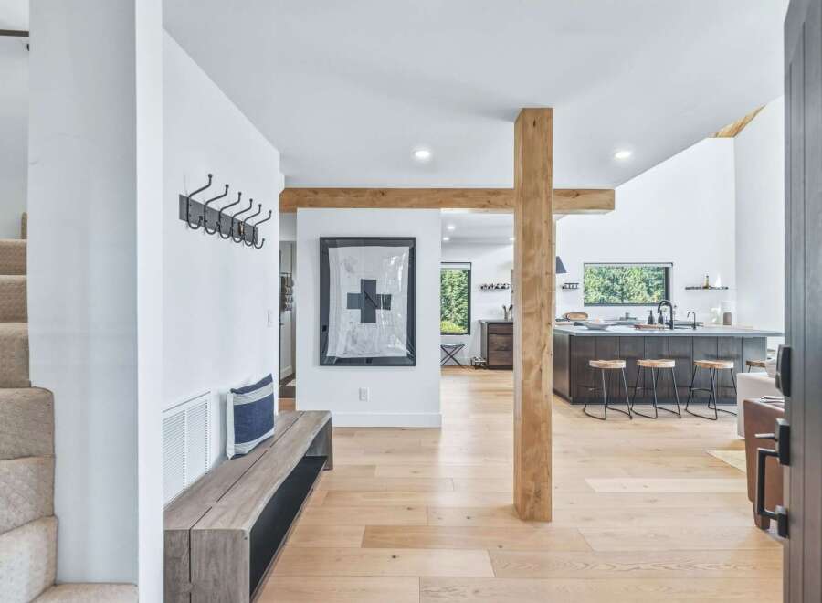 Step into this stunning modern home featuring an open-concept living space with a large kitchen island and ample natural light.