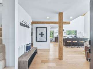Step into this stunning modern home featuring an open-concept living space with a large kitchen island and ample natural light.