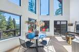 Experience breathtaking mountain views from this stunning modern home, featuring expansive floor-to-ceiling windows that flood the living space with natural light.