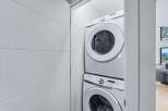 Discover modern convenience with this stacked Samsung washer and dryer set, perfect for maximizing space in your laundry area.