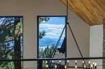 Experience breathtaking panoramic views of a serene lake and majestic mountains from this stunning property.