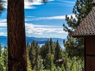 Experience breathtaking lake and mountain views from this stunning property, nestled amongst mature pine trees.