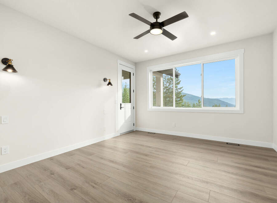 Experience breathtaking mountain views from this spacious room, featuring a large window that floods the space with natural light.