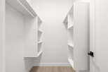 Step into this spacious walk-in closet, featuring ample shelving and hanging space to organize your wardrobe.