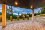 Enjoy breathtaking mountain views from this covered patio, perfect for outdoor entertaining or quiet relaxation.