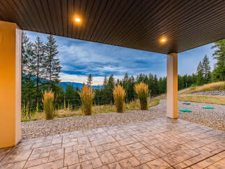 Enjoy breathtaking mountain views from this covered patio, perfect for outdoor entertaining or quiet relaxation.