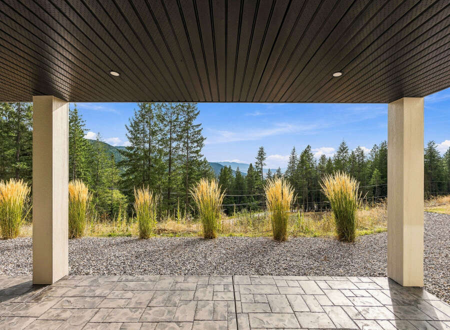Enjoy breathtaking mountain views from this covered patio, perfect for outdoor entertaining or quiet relaxation.