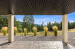 Enjoy breathtaking mountain views from this covered patio, perfect for outdoor entertaining or quiet relaxation.