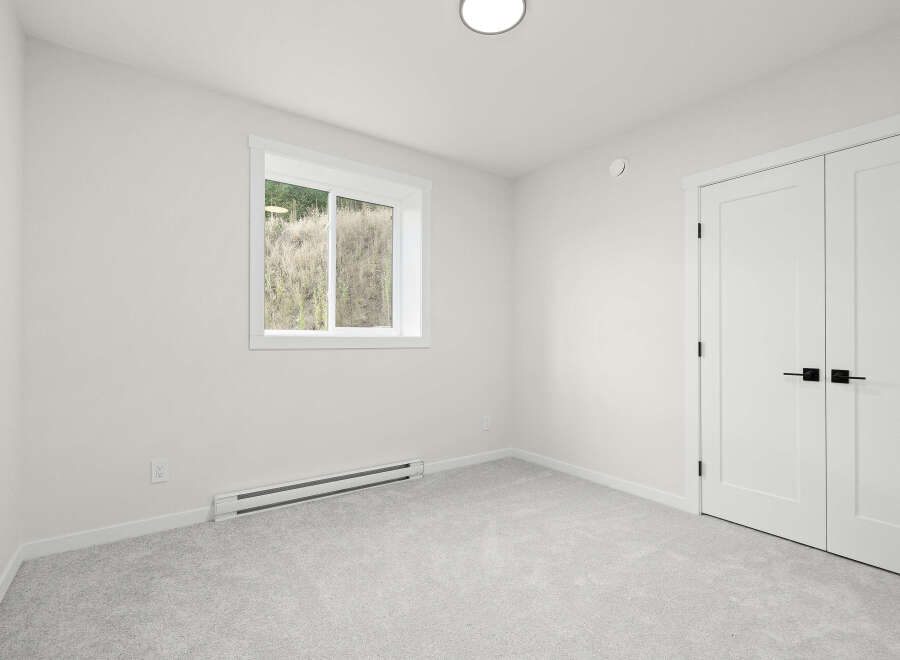 Discover comfort and style in this beautifully appointed room, featuring a large window that floods the space with natural light.