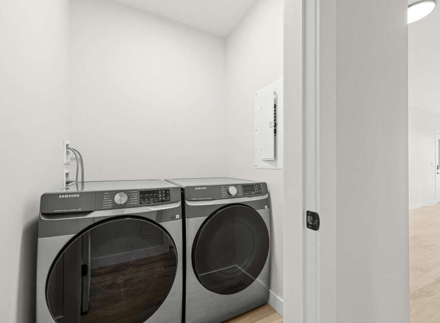Discover modern convenience with this stacked Samsung washer and dryer set, perfect for any laundry room.